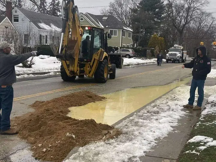 Main break causes odd-colored liquid to bubble from road, closing down Church Street