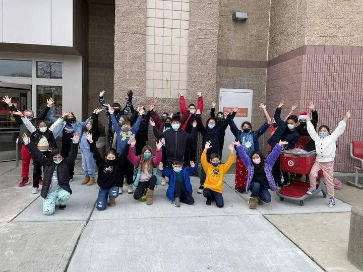 Elementary school students raise over $1,000 to purchase gifts for families in need