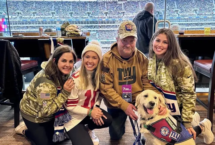 JK Consulting teams up with Giants and Paws of War to present service dog to veteran