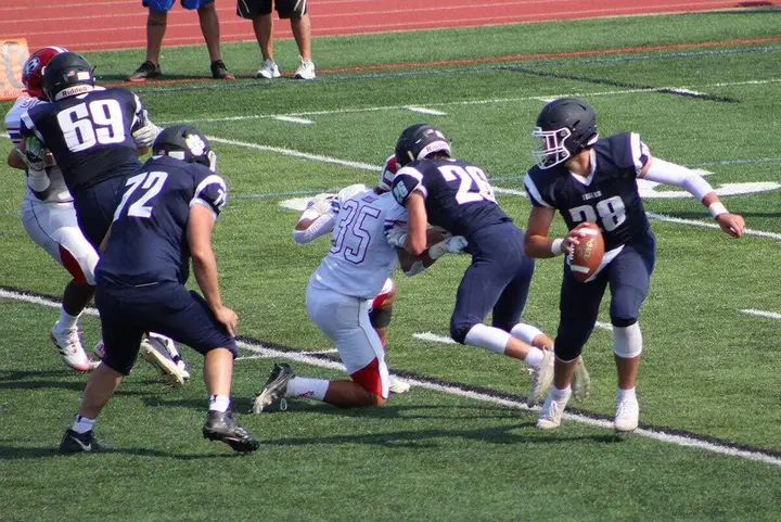 Northport Tigers celebrate a hard-earned win against Bellport in their season opener