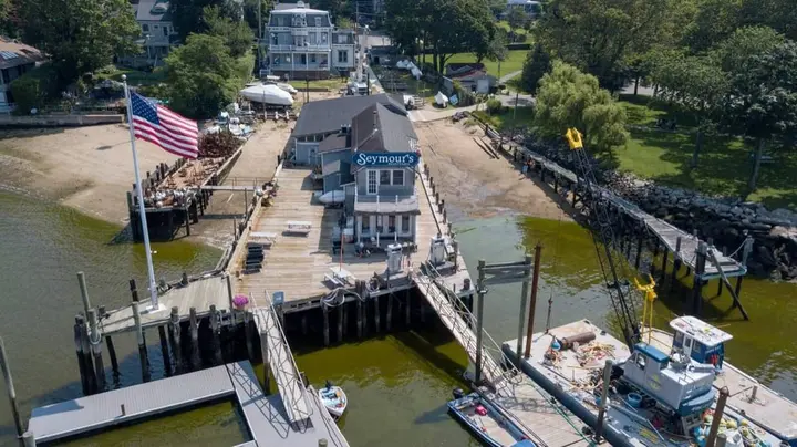 Heavy rains down Main Street cause curious green color in Northport Harbor