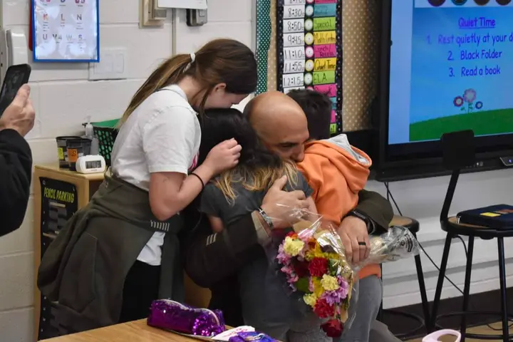 Children get surprise military homecoming from dad at their schools